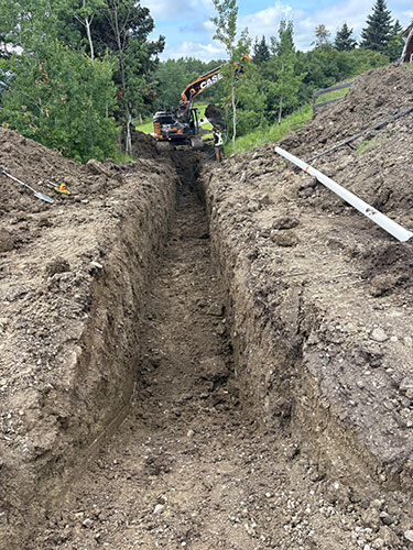 Image 2 - acreage development by Calgary's 2 Sons Excavating, waterline trenching.